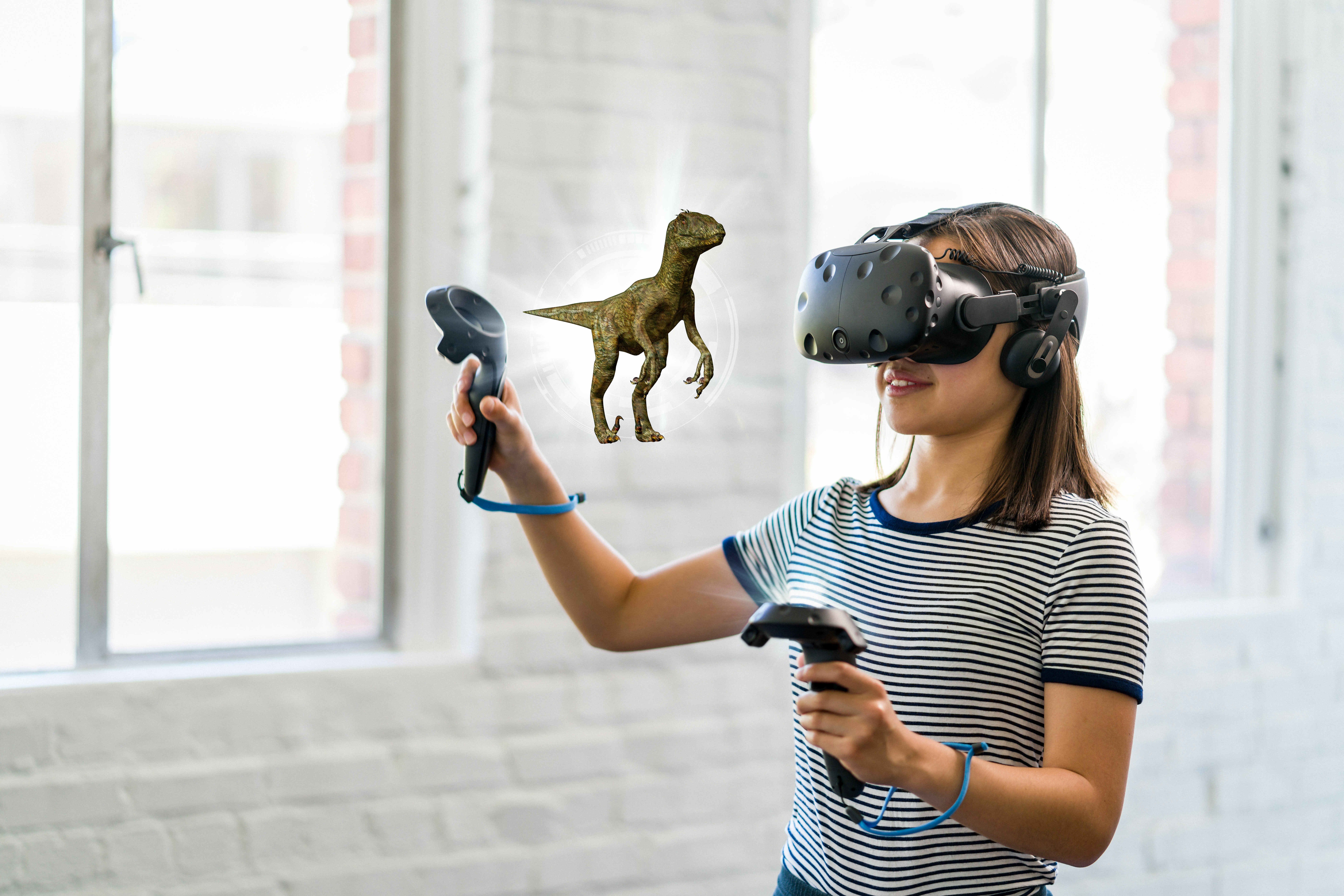 Girl wearing VR headset making dinosaur IFX