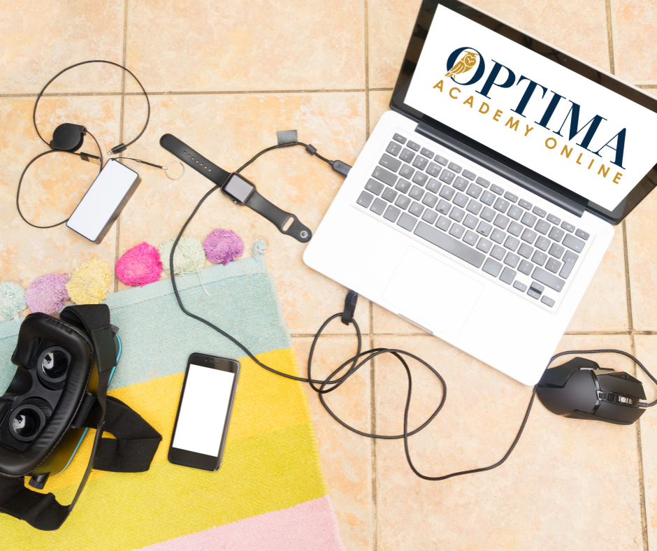 Computer, VR headset and phone sitting on desk. 