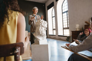 mature teacher talking with her students during cl 2023 11 27 05 01 19 utc